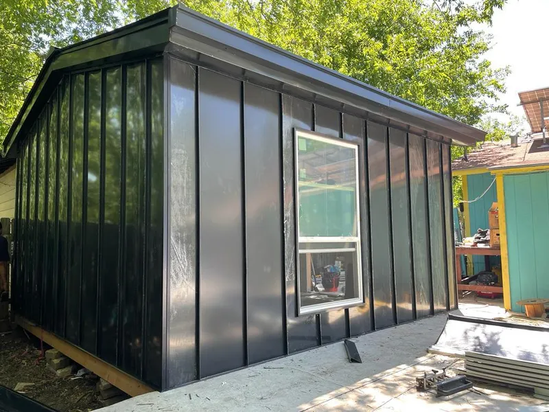 Black standing seam metal wall panels for Roof Inspection in Chickasaw